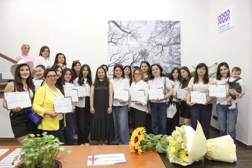 Graduates of Arev Society's AI training course for vulnerable women in Armenia holding their certificates