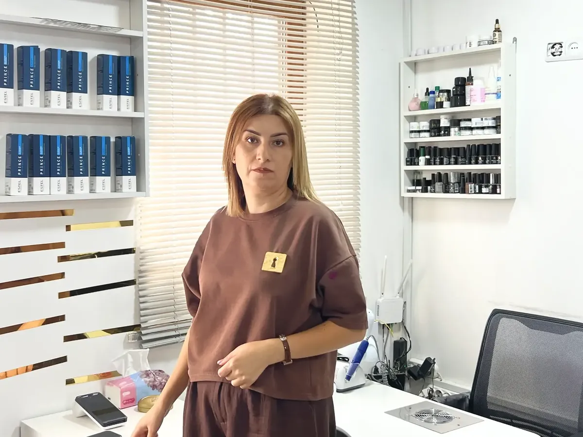 Lusine, a former teacher displaced from Shushi, in her beauty salon Luse in Merdzavan, Armenia